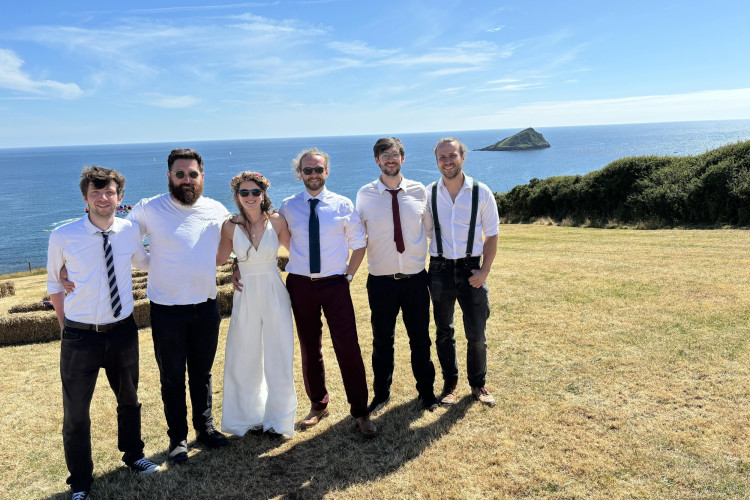 Buskers & Sons band for hire with the bride on a Devon clifftop