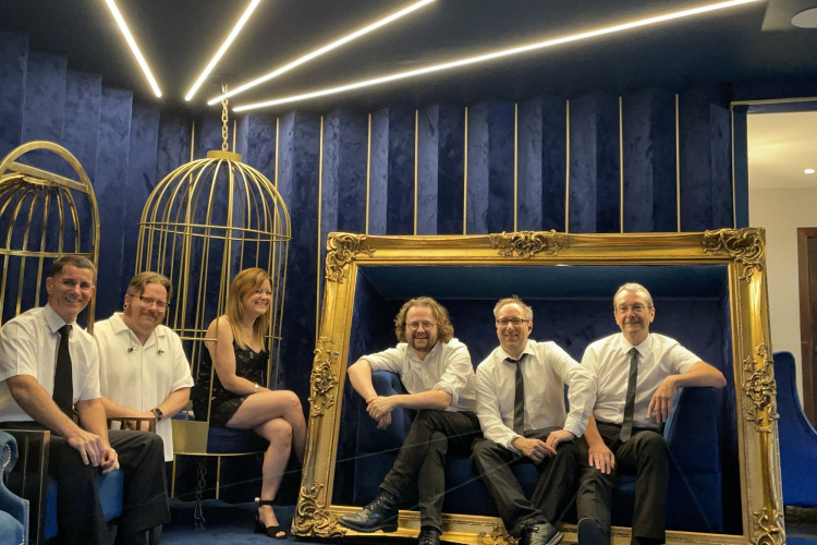 Reunion wedding band six piece promo shot in gold frame, Suffolk