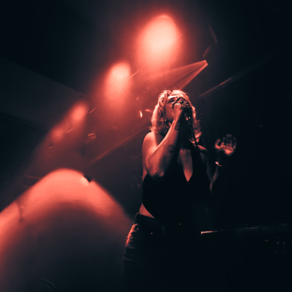 the honey band for hire singer silhouette red stage lights