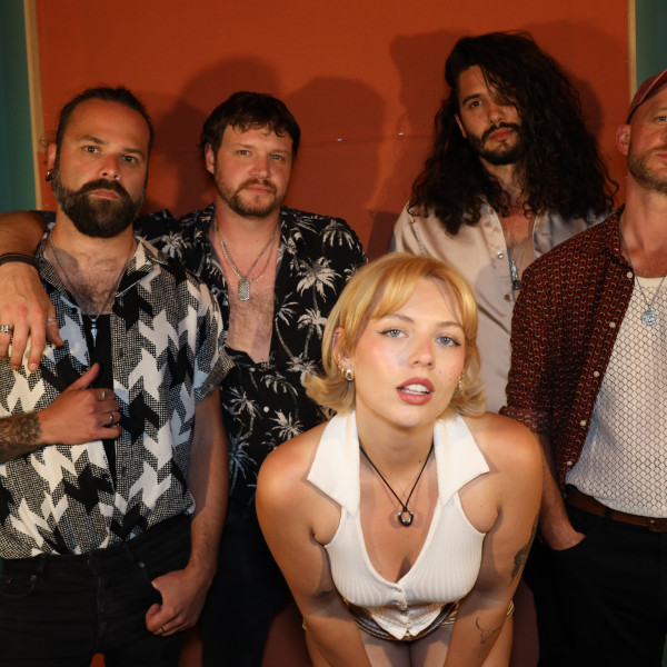 the honey corporate band singer leaning forward portrait