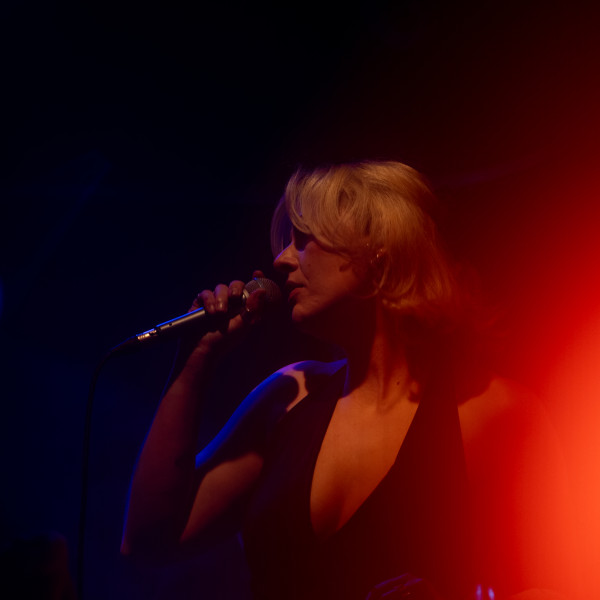 the honey corporate band singer performing red stage light