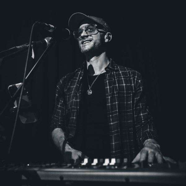 the honey function band keyboardist playing live black and white