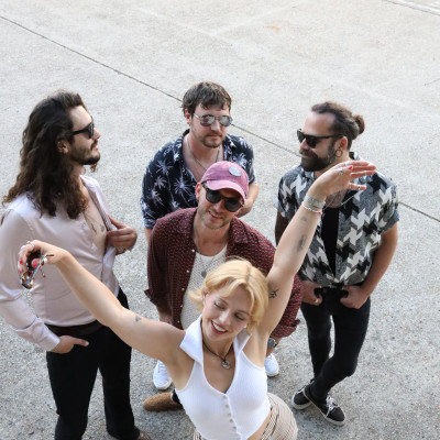the honey function band walking outdoors laughing