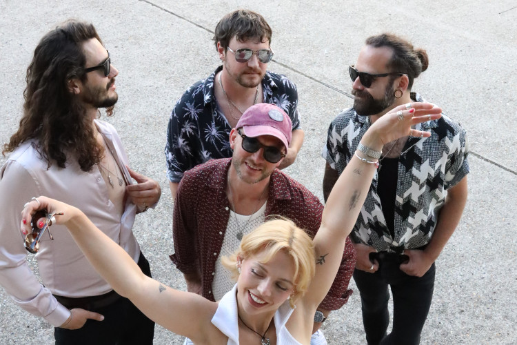 the honey function band walking outdoors laughing