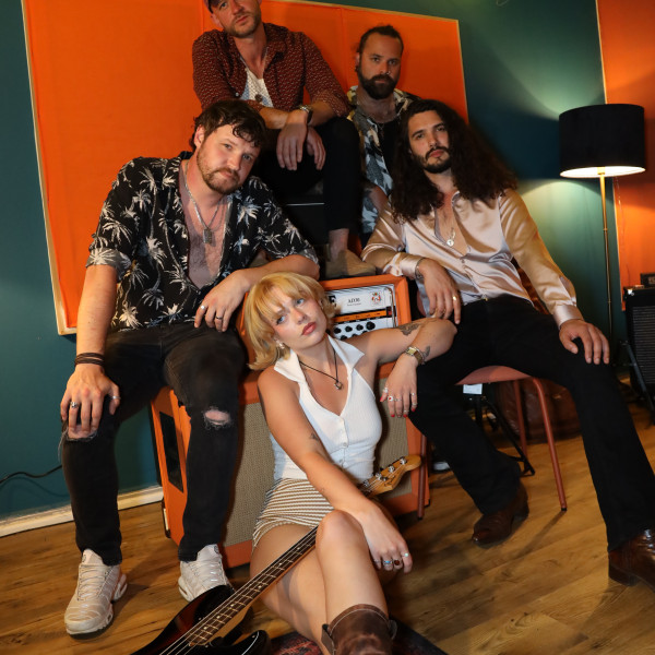 the honey party band huddled together laughing photoshoot