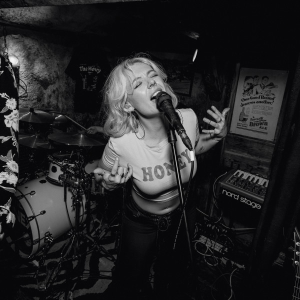 the honey wedding band singer belting vocals arms raised live