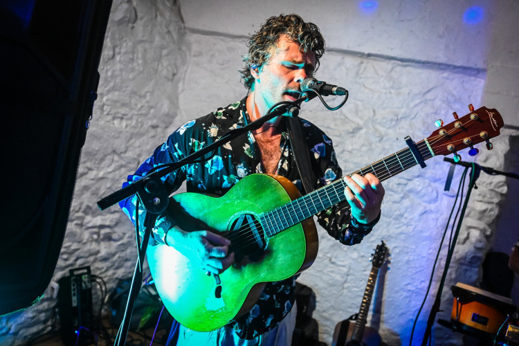 Busta Groove - Singer Playing Acoustic Guitar Live