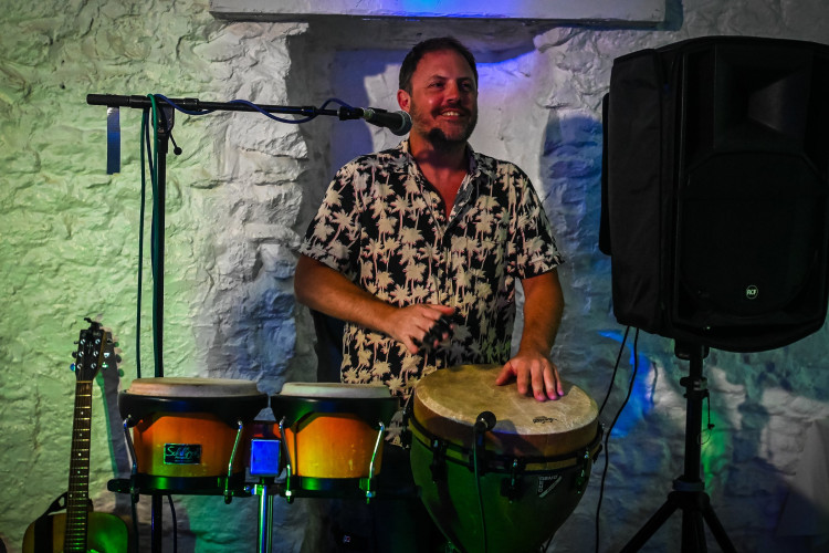 Busta Groove - Percussionist Playing Congas and Djembe Live